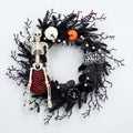 Gothic Halloween Skeleton Wreath with Faux Pumpkins and Black Branches