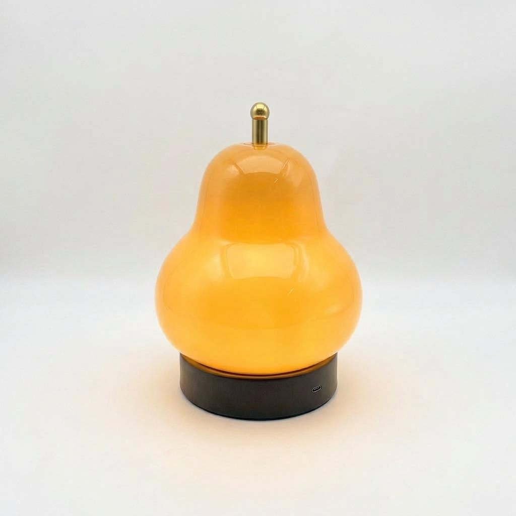 Pear-shaped glass table lamp with warm ambient glow