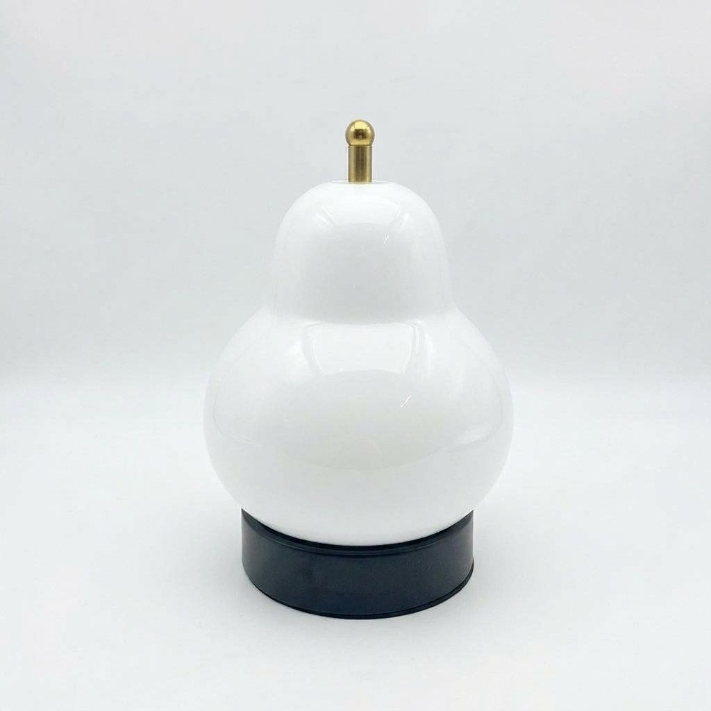 Pear-shaped glass table lamp with warm ambient glow — White