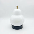 Pear-shaped glass table lamp with warm ambient glow — White