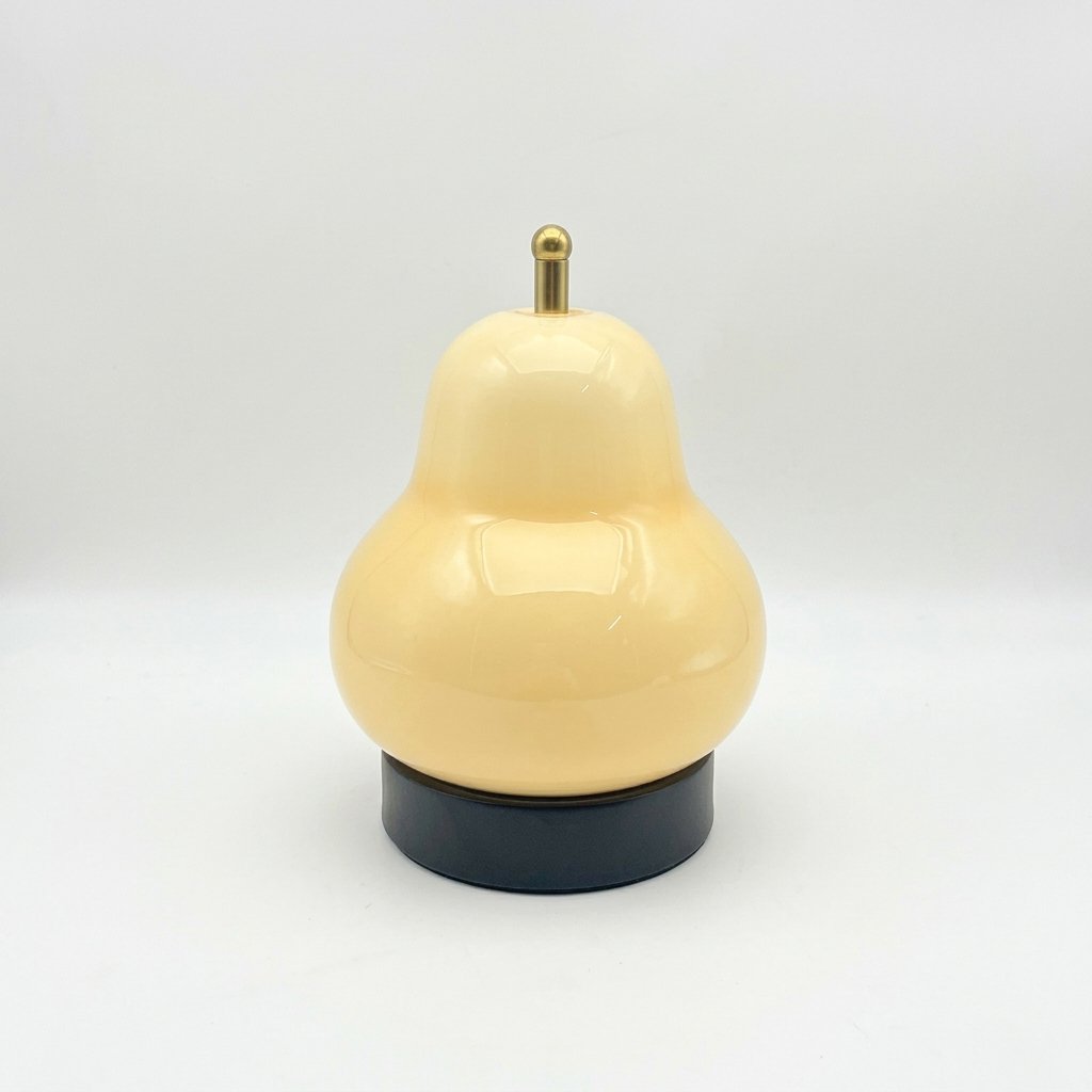 Pear-shaped glass table lamp with warm ambient glow — Cream